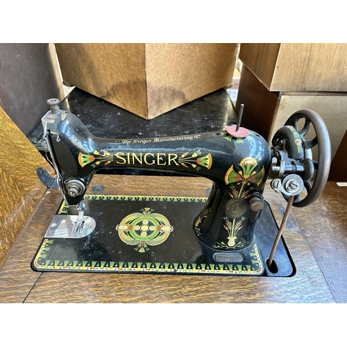 157 - A 1920 Singer cast iron and oak treadle sewing machine - serial no. F9848923