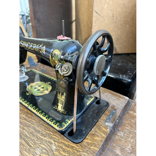 157 - A 1920 Singer cast iron and oak treadle sewing machine - serial no. F9848923