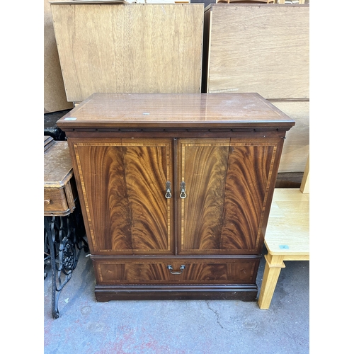 159 - A Strongbow Furniture mahogany two door TV cabinet