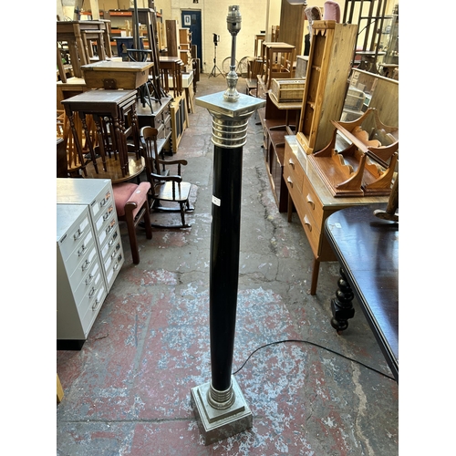 161 - A modern ebonized and chrome plated standard lamp - approx. 137cm high