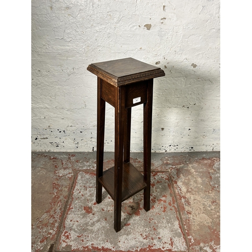 167 - An early 20th century carved oak jardinière stand - approx. 92cm high