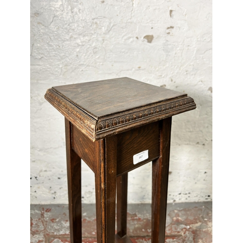 167 - An early 20th century carved oak jardinière stand - approx. 92cm high