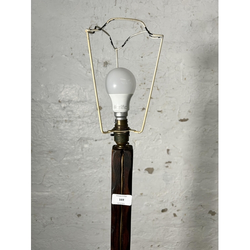 169 - An Arts & Crafts style pine standard lamp - approx. 142cm high