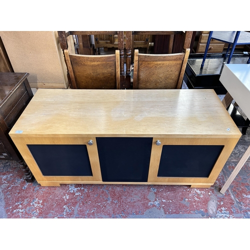 172 - A modern beech and blue fabric TV stand - approx. 61cm high x 133cm wide x 48cm deep