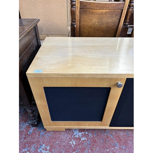 172 - A modern beech and blue fabric TV stand - approx. 61cm high x 133cm wide x 48cm deep