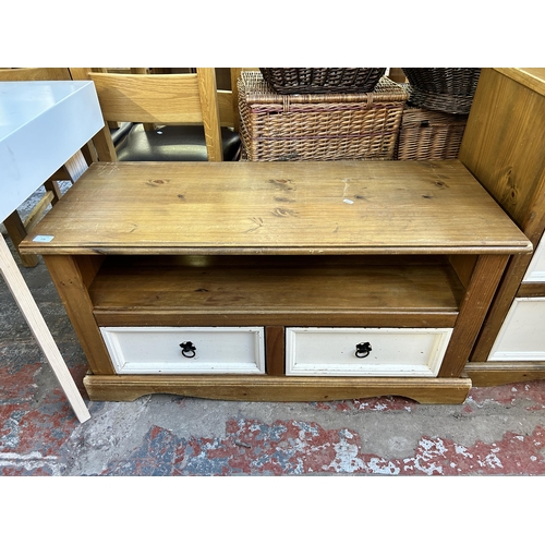 176 - A Mexican pine and white painted two drawer TV stand