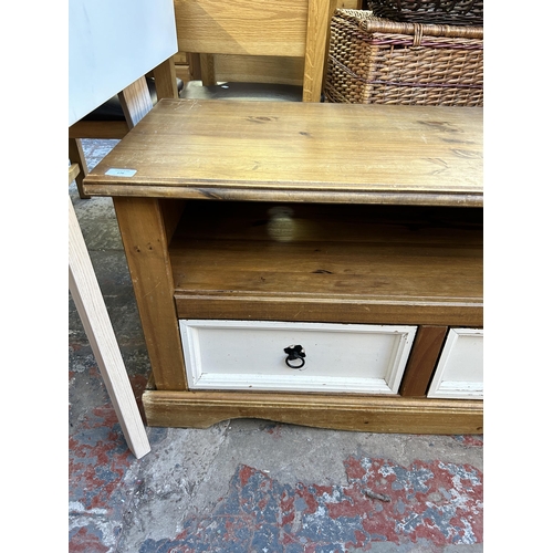 176 - A Mexican pine and white painted two drawer TV stand