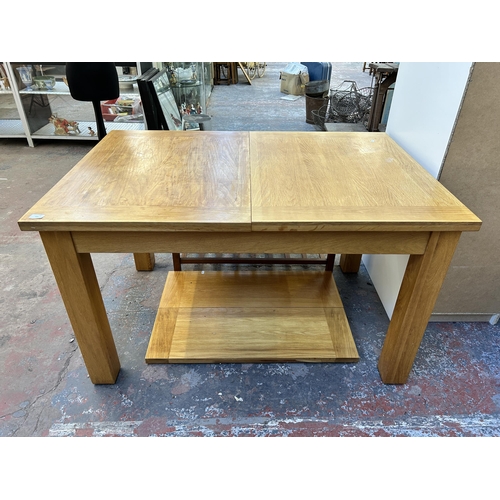 183 - A modern solid oak extending dining table - approx. 77cm high x 90cm wide x 132cm long not extended