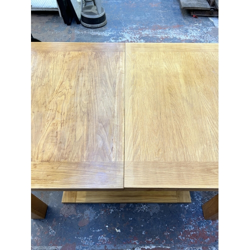 183 - A modern solid oak extending dining table - approx. 77cm high x 90cm wide x 132cm long not extended