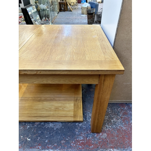 183 - A modern solid oak extending dining table - approx. 77cm high x 90cm wide x 132cm long not extended