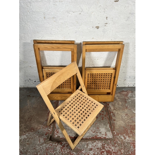 184 - Five contemporary oak folding chairs to include one stamped made in Italy by Magis