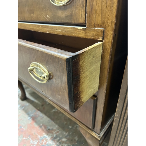 32 - A mid 20th century oak bureau on cabriole supports