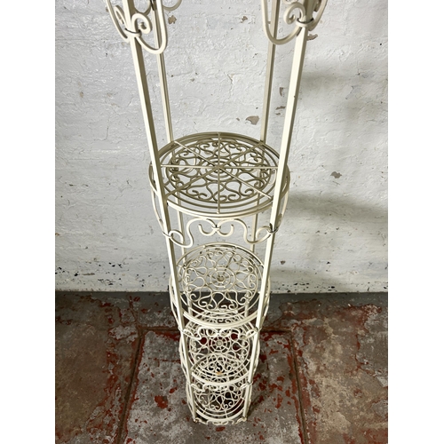 35 - A Victorian style white metal four tier plant stand - approx. 177cm high