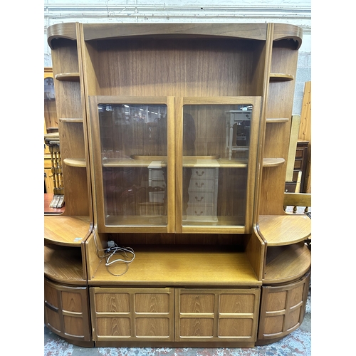 38 - Three Nathan teak display cabinets, two corner - approx. 194cm high x 63cm wide and one 194cm high x... 