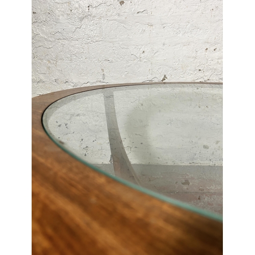 43 - A G Plan Astro teak and glass circular coffee table - approx. 46cm high x 84cm in diameter