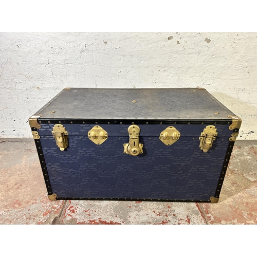 57 - A mid 20th century blue painted and brass bound travel trunk - approx. 50cm high x 92cm wide x 51cm ... 