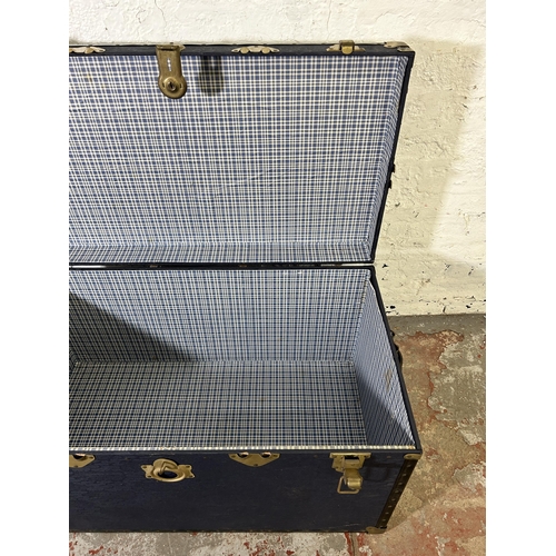 57 - A mid 20th century blue painted and brass bound travel trunk - approx. 50cm high x 92cm wide x 51cm ... 