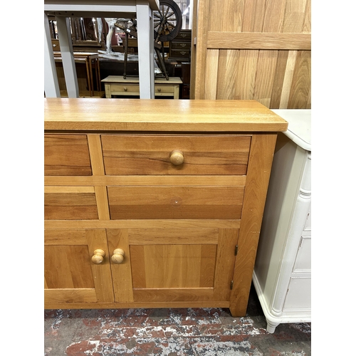 65 - A modern oak sideboard - approx. 90cm high x 120cm wide x 37cm deep