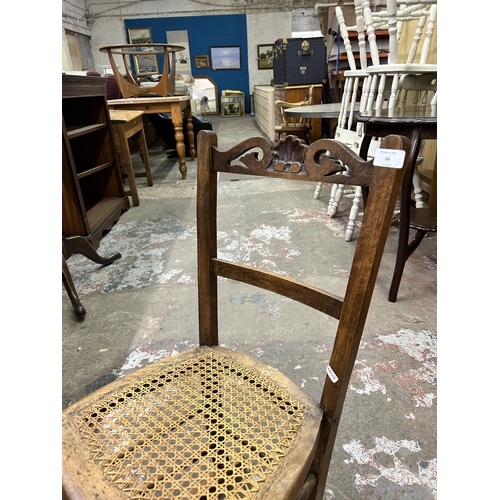 66 - An Edwardian carved beech and rattan rocking chair