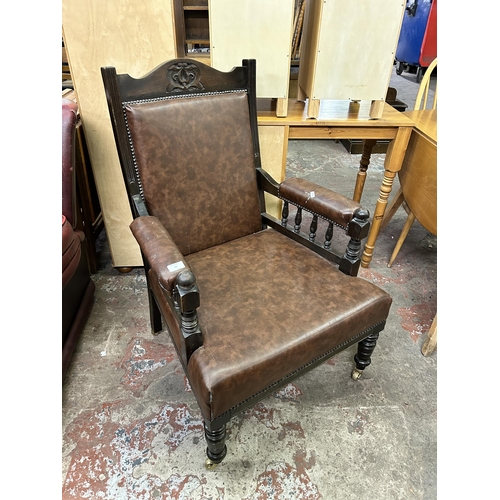 68 - An Edwardian carved beech and brown vinyl parlour chair