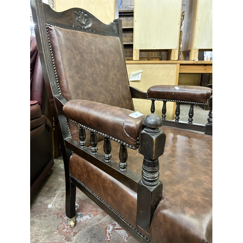 68 - An Edwardian carved beech and brown vinyl parlour chair