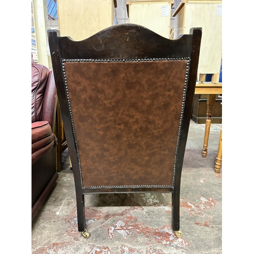 68 - An Edwardian carved beech and brown vinyl parlour chair