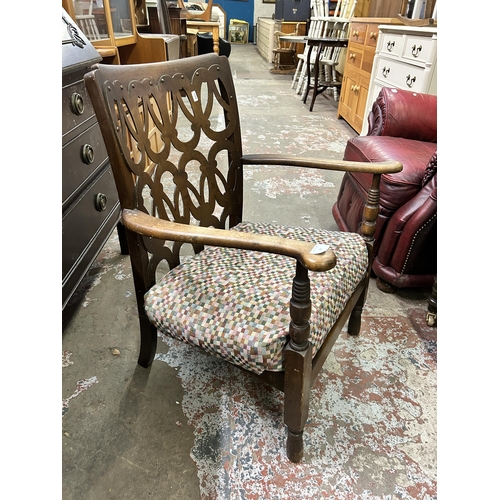 69 - A mid 20th century beech armchair with fabric upholstered cushion