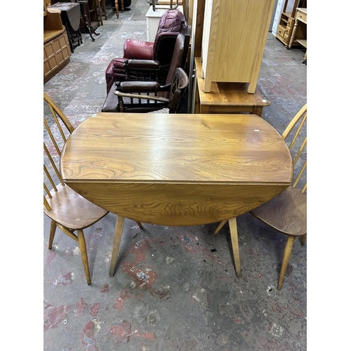 70 - A 1960s Ercol Windsor blonde elm and beech drop leaf dining table and two Quaker dining chairs - tab... 