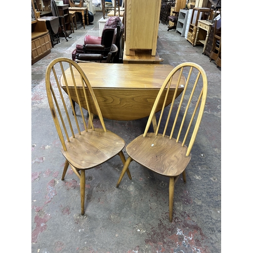 70 - A 1960s Ercol Windsor blonde elm and beech drop leaf dining table and two Quaker dining chairs - tab... 