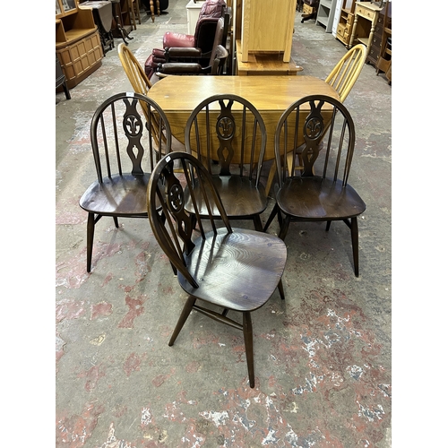 71 - Four Ercol Fleur De Lys elm and beech dining chairs