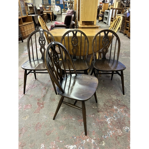 71 - Four Ercol Fleur De Lys elm and beech dining chairs