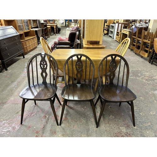 71 - Four Ercol Fleur De Lys elm and beech dining chairs