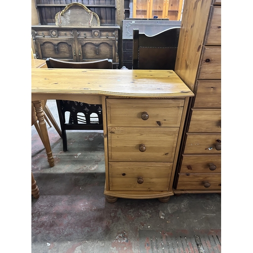 73 - A pine three drawer dressing table - approx. 77cm high x 94cm wide x 44cm deep