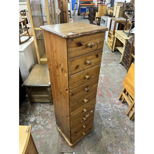 74 - A pine chest of drawers - approx. 140cm high x 43cm wide x 39cm deep