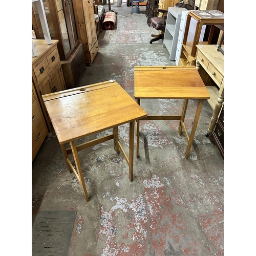 75 - A pair of mid 20th century beech folding child's school desks - approx. 76cm high x 56cm wide x 51cm... 