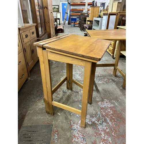 75 - A pair of mid 20th century beech folding child's school desks - approx. 76cm high x 56cm wide x 51cm... 