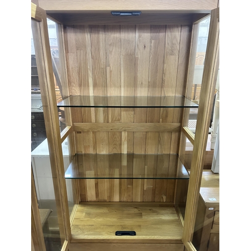 77 - A modern oak display cabinet - approx. 180cm high x 87cm wide x 39cm deep