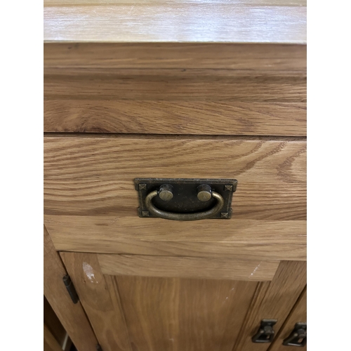 79 - A modern oak sideboard - approx. 80cm high x 80cm wide x 34cm deep