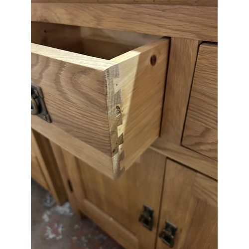 79 - A modern oak sideboard - approx. 80cm high x 80cm wide x 34cm deep