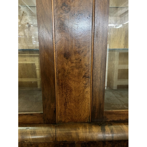 80 - An Art Deco walnut display cabinet - approx. 158cm high x 126cm wide x 38cm deep