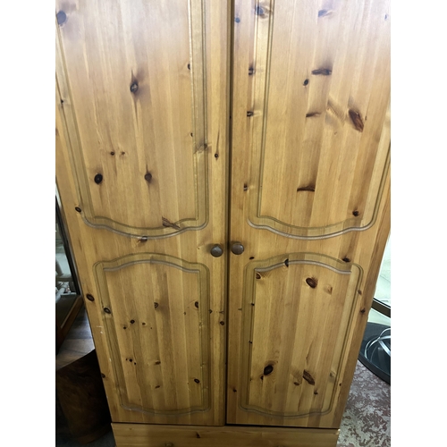 81 - A pine double wardrobe - approx. 180cm high x 88cm wide x 57cm deep