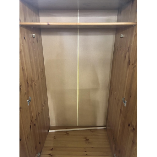 81 - A pine double wardrobe - approx. 180cm high x 88cm wide x 57cm deep