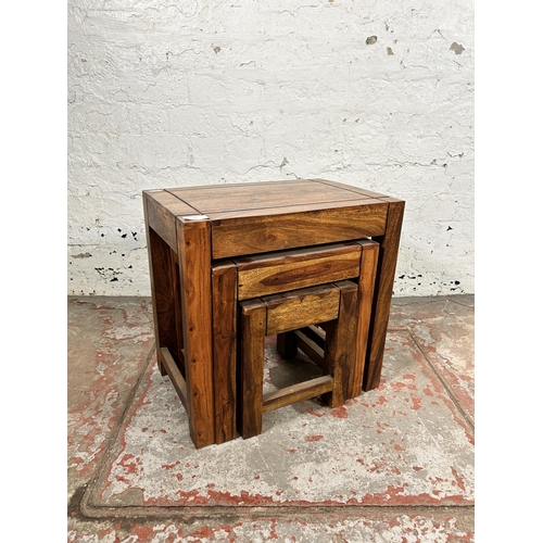 83 - An Indian sheesham wood nest of tables - approx. 45cm high x 45cm wide x 30cm deep