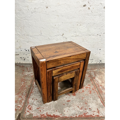 83 - An Indian sheesham wood nest of tables - approx. 45cm high x 45cm wide x 30cm deep