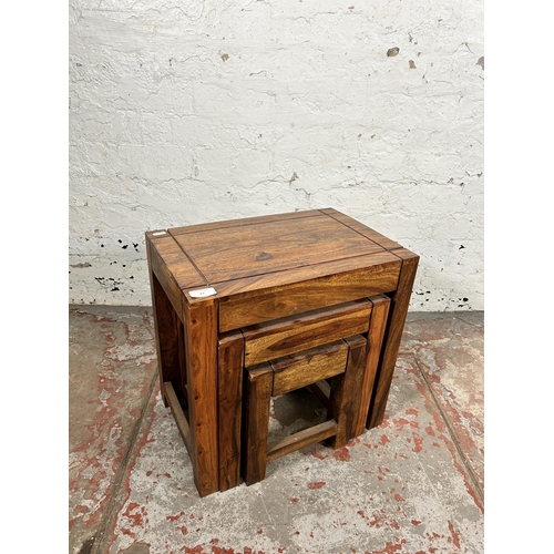 83 - An Indian sheesham wood nest of tables - approx. 45cm high x 45cm wide x 30cm deep