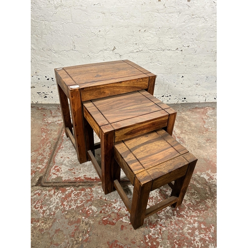 83 - An Indian sheesham wood nest of tables - approx. 45cm high x 45cm wide x 30cm deep