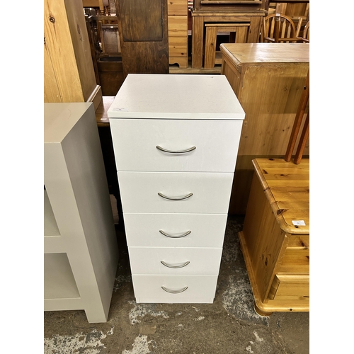 95 - A modern white laminate chest of drawers - approx. 90cm high x 34cm wide x 36cm deep