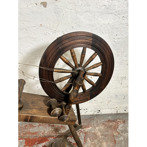 98 - A Victorian style elm and beech spinning wheel - approx. 81cm high x 76cm long