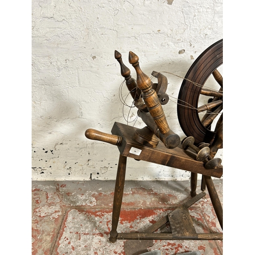 98 - A Victorian style elm and beech spinning wheel - approx. 81cm high x 76cm long