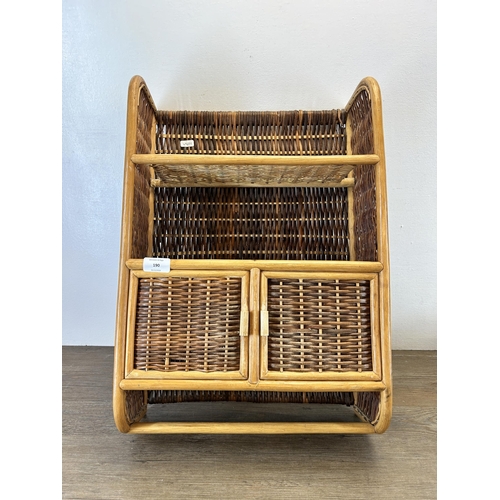 190 - A mid 20th century wicker wall hanging two tier shelving unit - approx. 57cm high x 40cm wide x 16cm... 